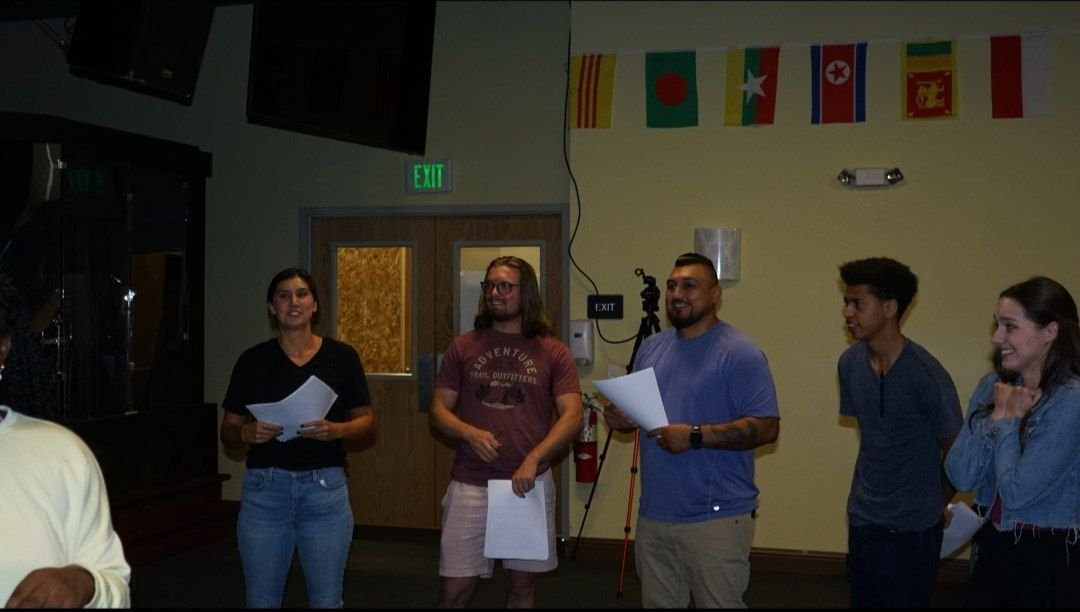 Cast members holding scripts on the Between Two Lives set