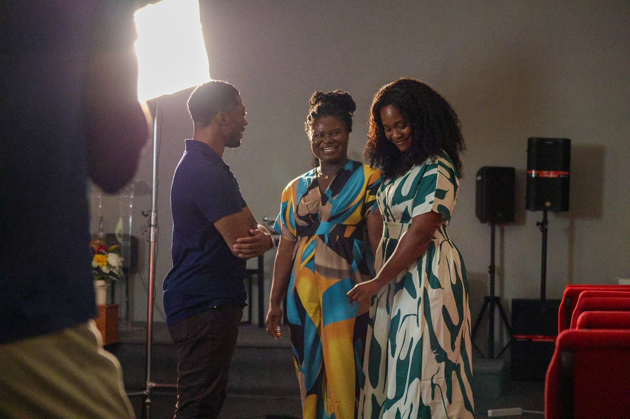 Between Two Lives church stage scene with three characters in conversation